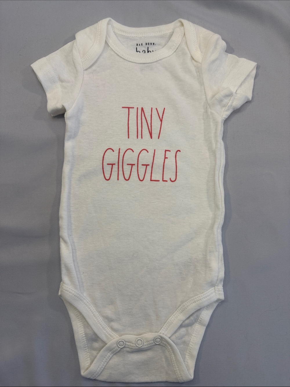 Rae Dunn NWOT White Bodysuit with Pink "Tiny Giggles" Text